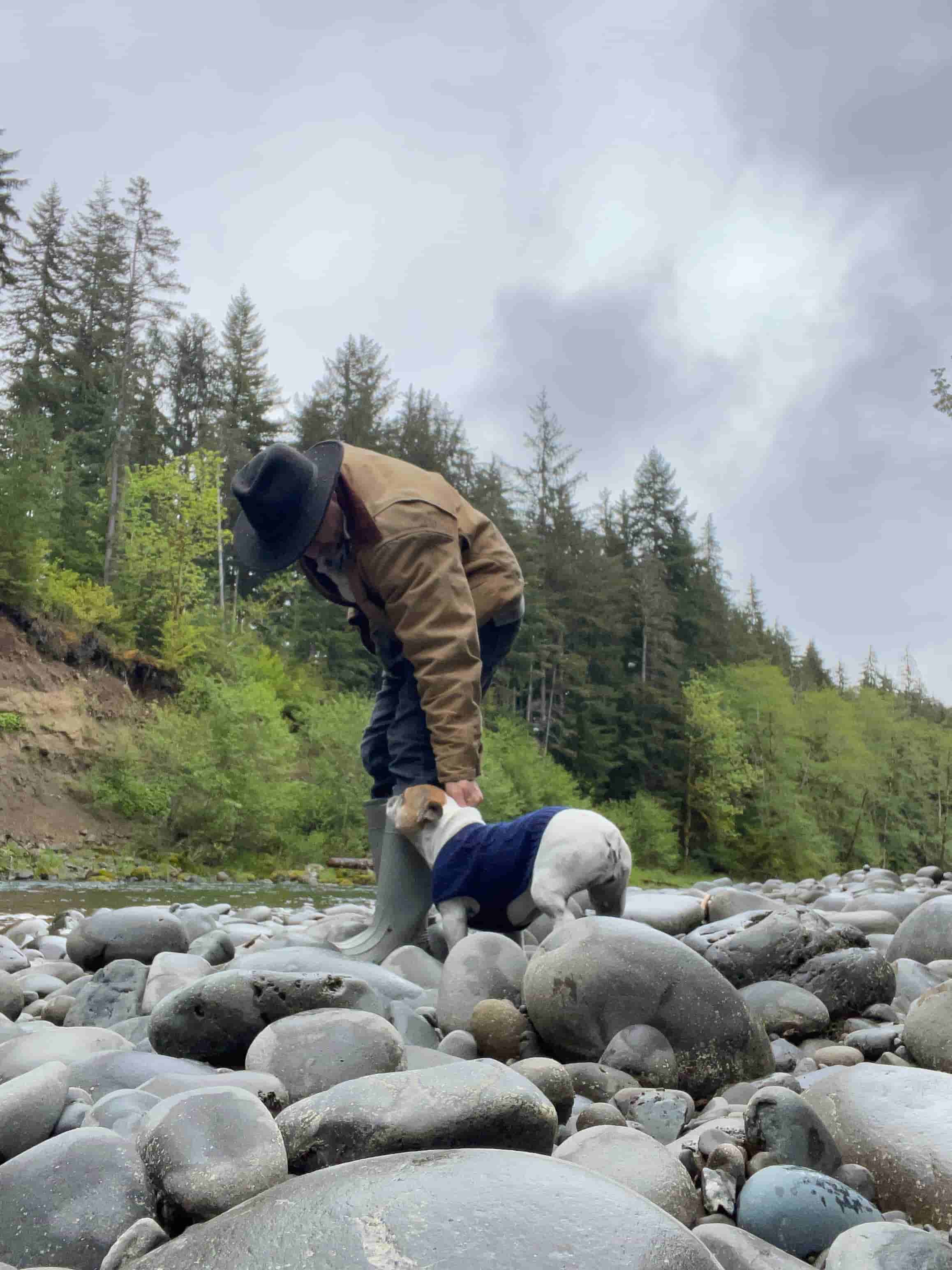David All with his pups along a river on the Olympic Peninsula, Washington